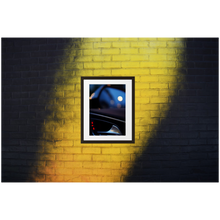 Framed Photo Print Poster "RS6 Blurr" on black & yellow brick wall. Shows a bokeh version of the inside of a Audi RS6 door. Moody Photography by Jacob Sellström. Printed on matte paper with wooden frame. Two sizes: 8x10, 12x16.